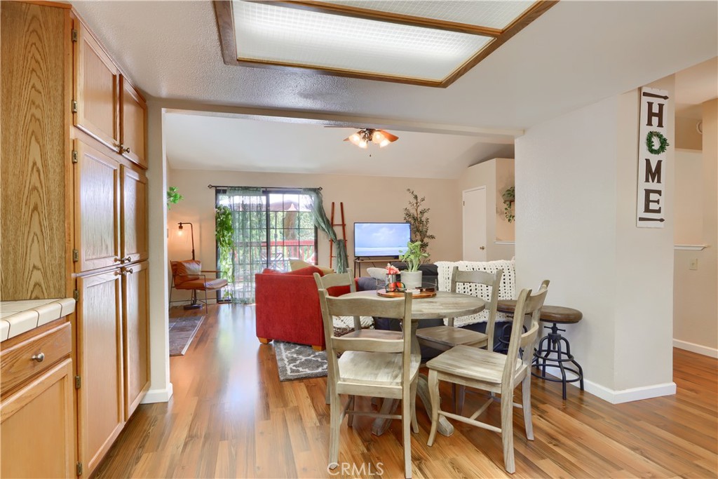 50840 Smoke Tree Trail Bass Lake, CA 93604 - Photo 19 of 36 a view of a dining room with furniture window and wooden floor