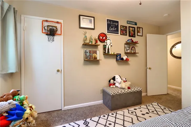 a living room with a couch and dresser
