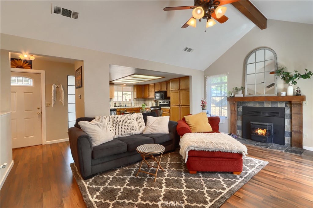 50840 Smoke Tree Trail Bass Lake, CA 93604 - Photo 9 of 36 a living room with furniture and a fireplace