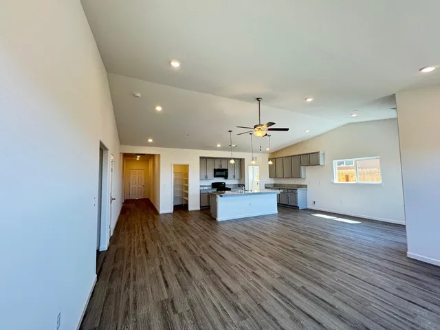 a view of kitchen with cabinets and wooden floor