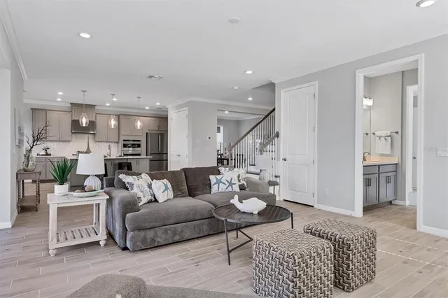 a living room with furniture and a rug