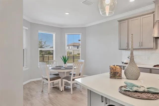 a dining room with furniture and window