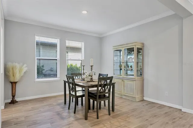 a view of a dining room with furniture and window