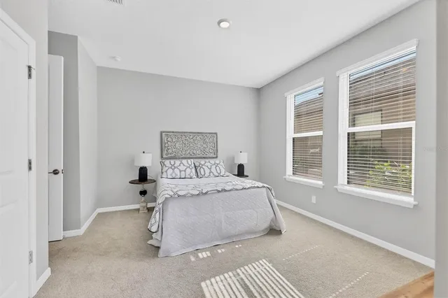 a en suite bathroom with a sink double vanity and a mirror