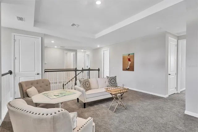 a bedroom with a bed and a view of cabinet