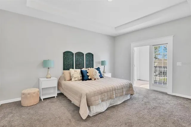 a bedroom with bed and a night stand