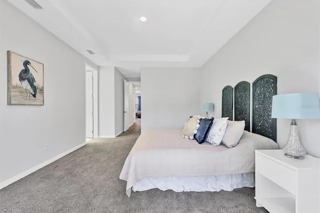 a bathroom with a granite countertop tub sink and mirror