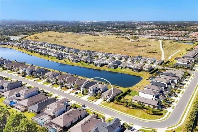 an aerial view of a swimming pool and an ocean view