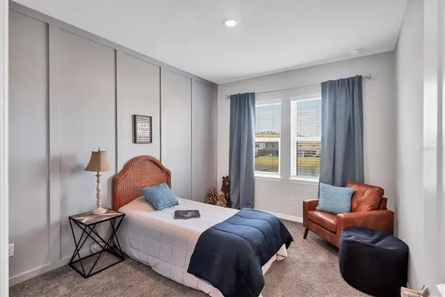 a bedroom with a bed and window