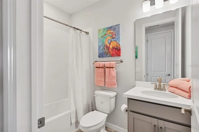 a room with pool table and sofas