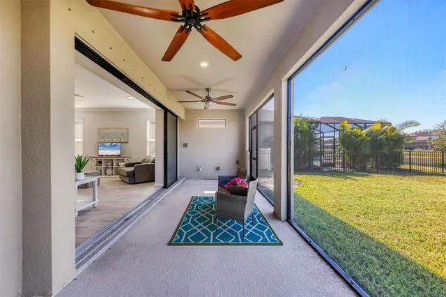 an aerial view of residential houses with outdoor space and ocean view