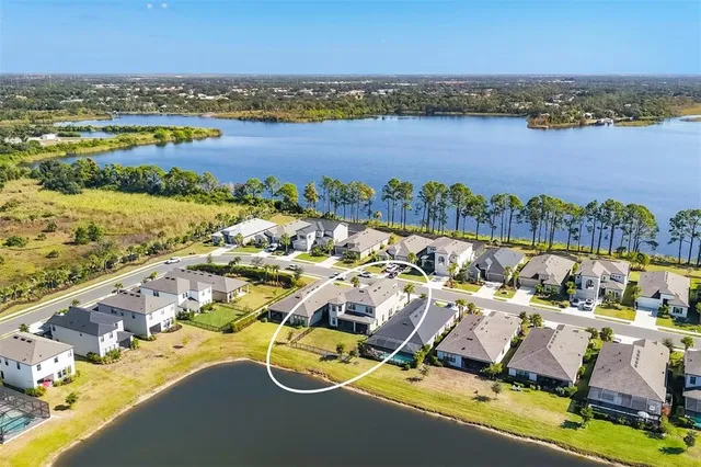 a view of a swimming pool and outdoor seating