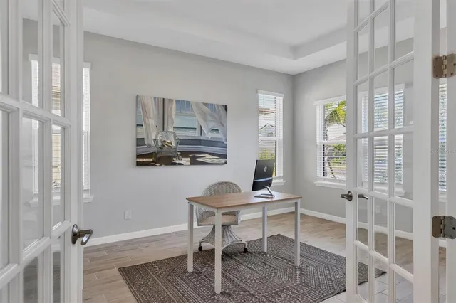 a workspace with furniture and window