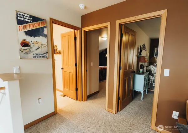 a bedroom with a bed and a television