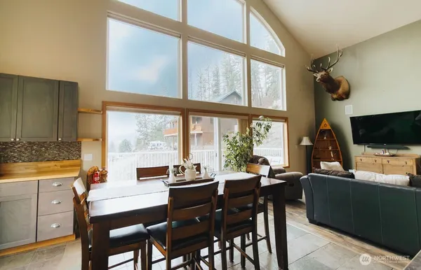 a view of a dining room with furniture window and outside view