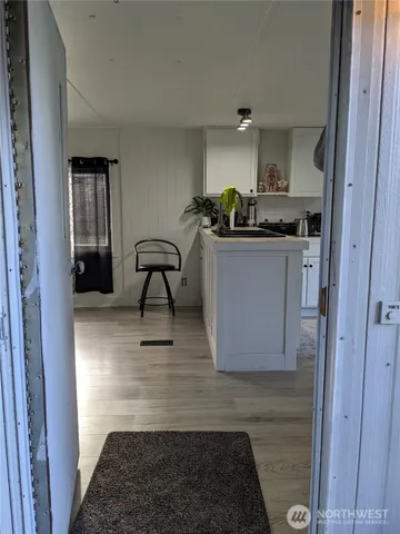 a view of living room with furniture and rug