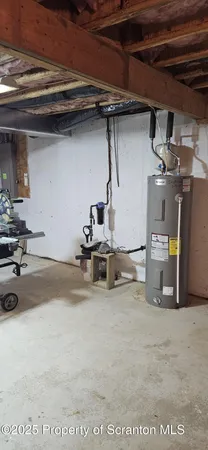 a view of a roof deck with table and chairs a barbeque with wooden floor and fence