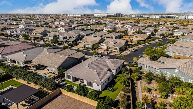 a view of a hallway with wooden floor and a living room