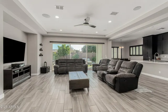 a large white kitchen with a large window