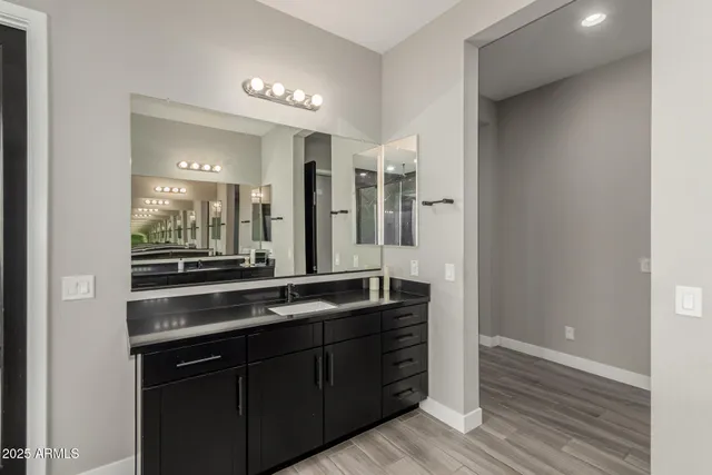 a bedroom with a large bed and a large window