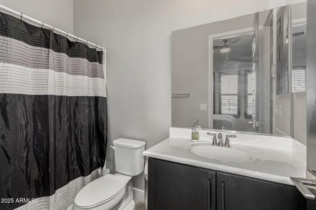 a wooden bench sitting in the middle of a yard