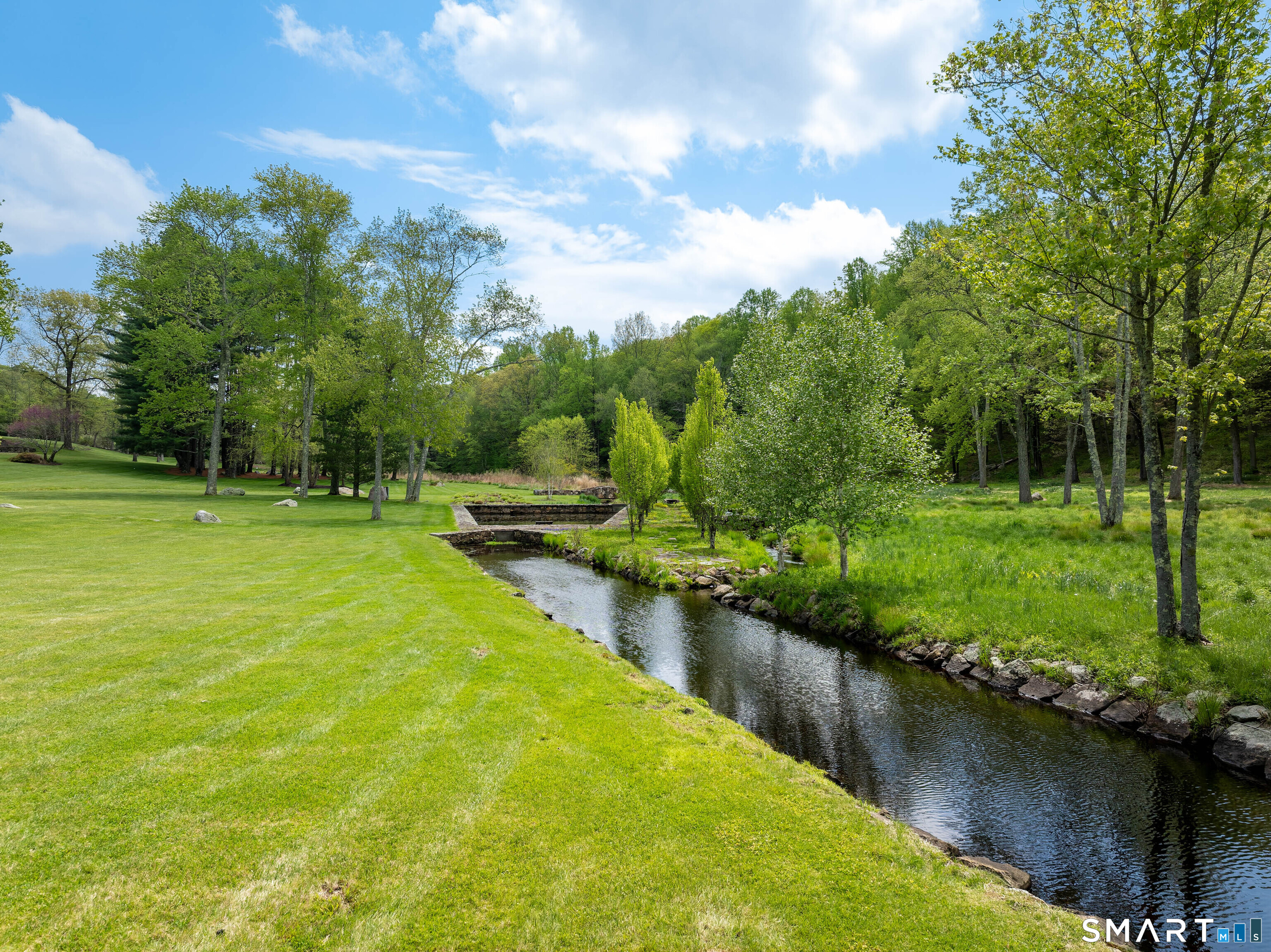 155 Long Ridge Road Danbury, CT 06810 - Photo 9 of 40 Water and open meadow combine here to create one of the most peaceful stretches of the property.
