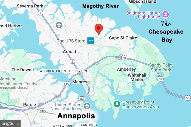 a view of swimming pool with lawn chairs under an umbrella