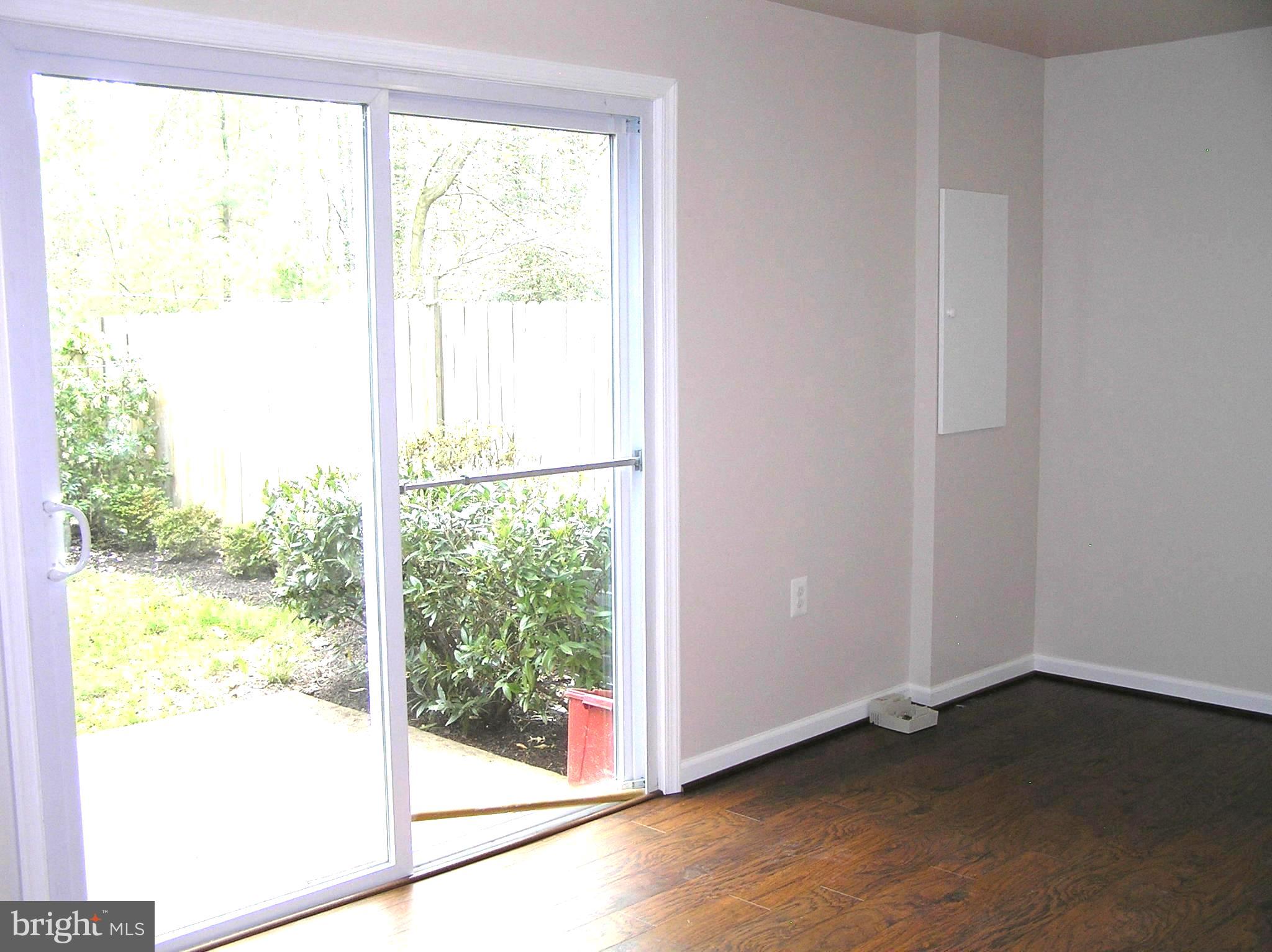 10053 Chestnut Wood Lane Burke, VA 22015 - Photo 20 of 28 a view of a large window with wooden floor