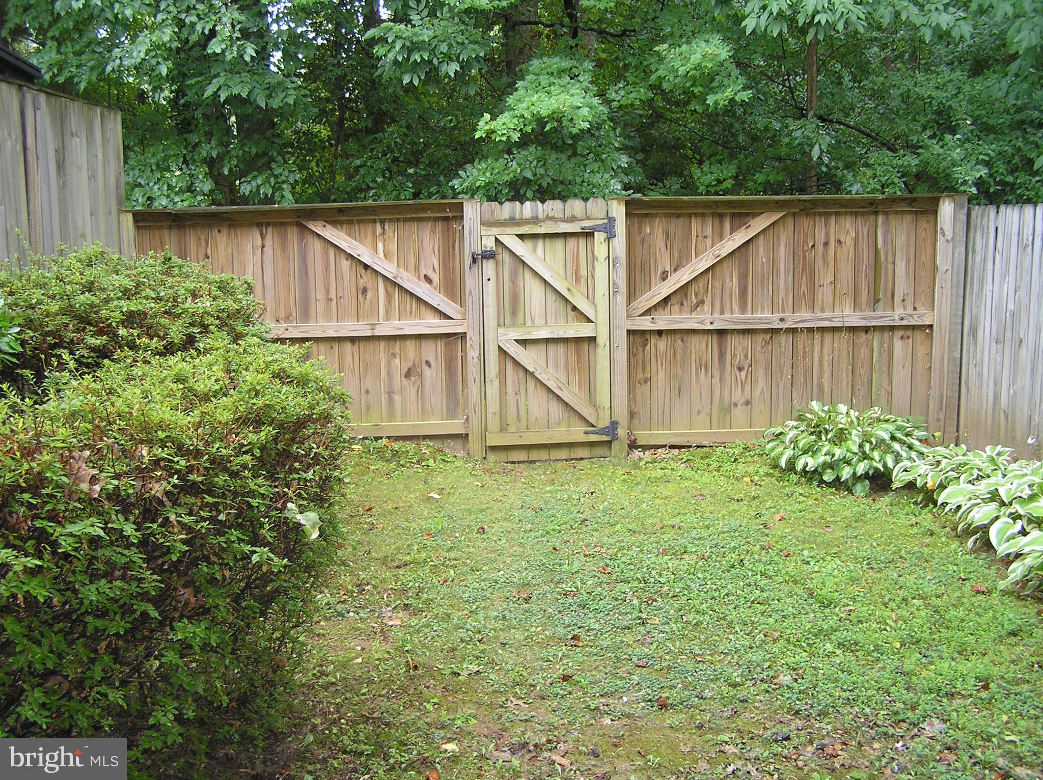 10053 Chestnut Wood Lane Burke, VA 22015 - Photo 22 of 28 a house view with a garden space