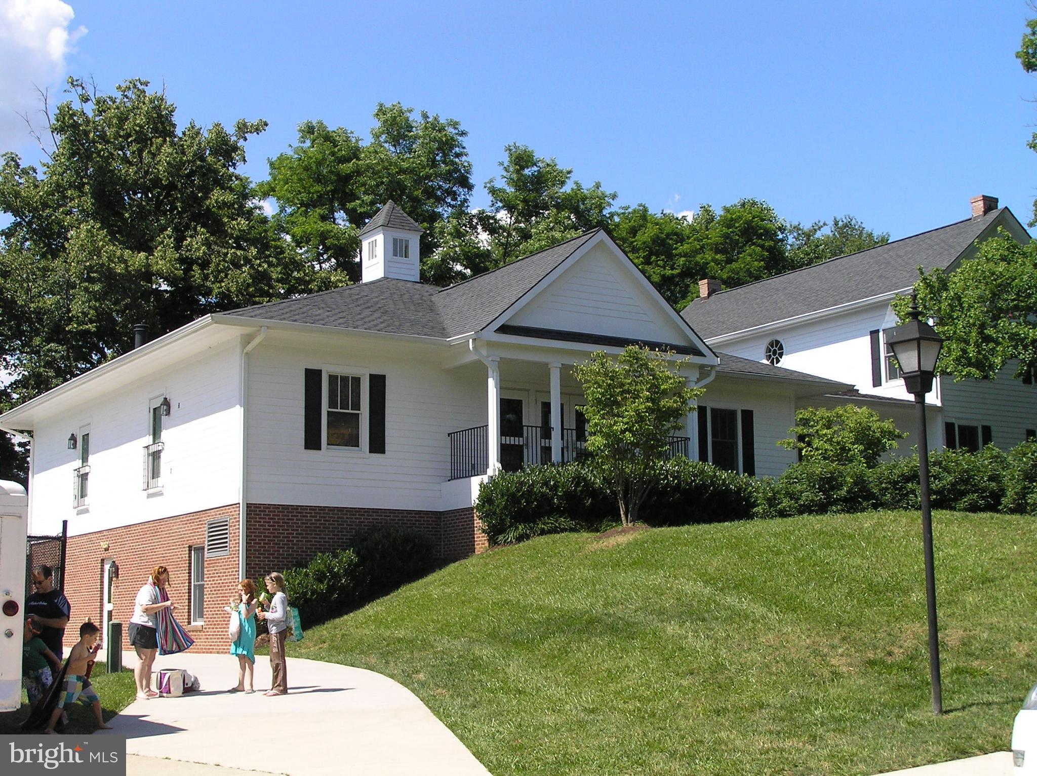 10053 Chestnut Wood Lane Burke, VA 22015 - Photo 25 of 28 a front view of a house with garden