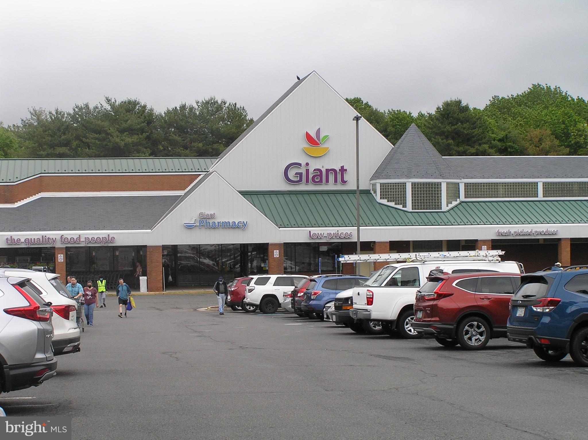 10053 Chestnut Wood Lane Burke, VA 22015 - Photo 28 of 28 a group of cars parked in front of a building