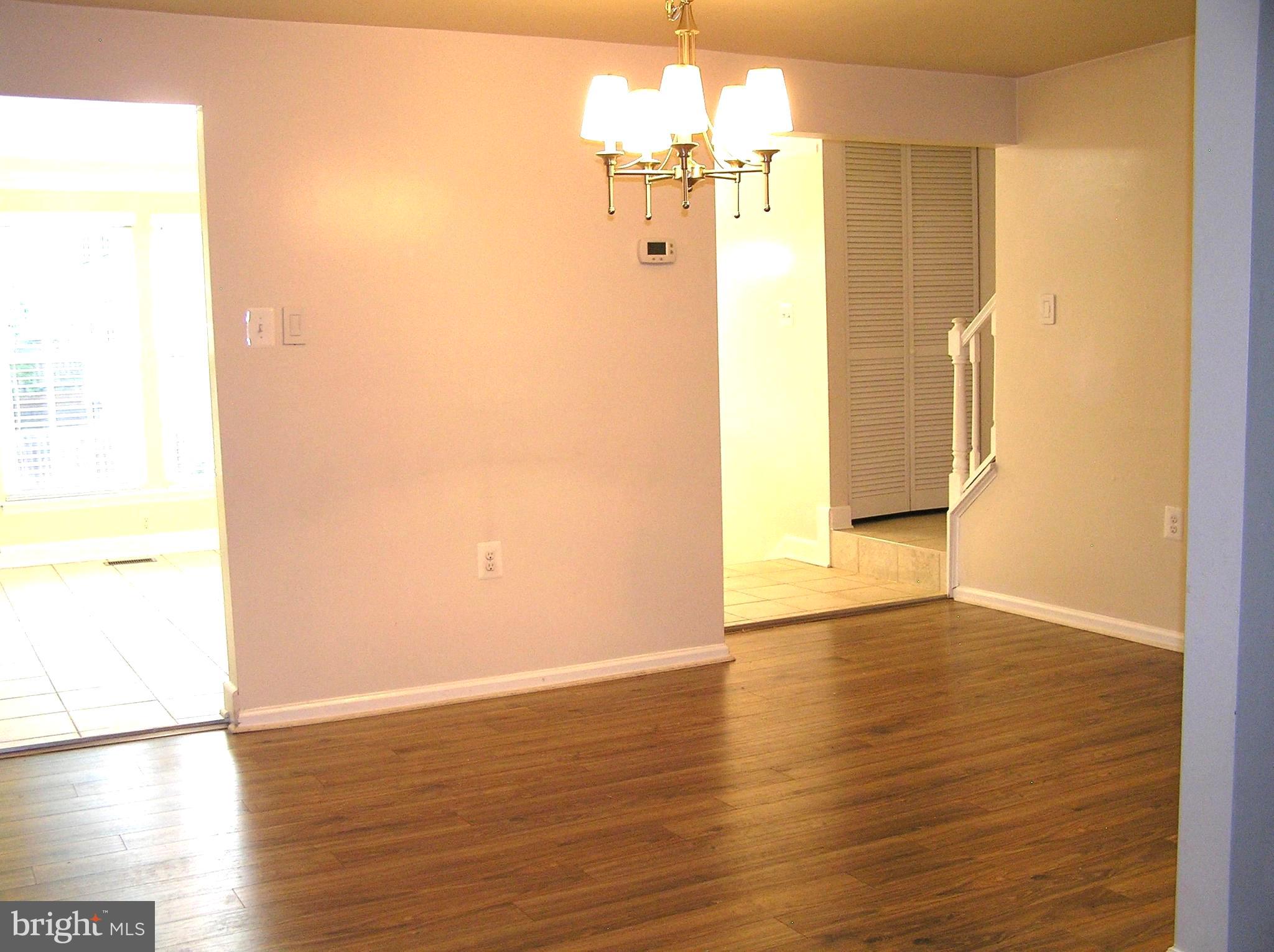 10053 Chestnut Wood Lane Burke, VA 22015 - Photo 7 of 28 a view of an empty room with wooden floor