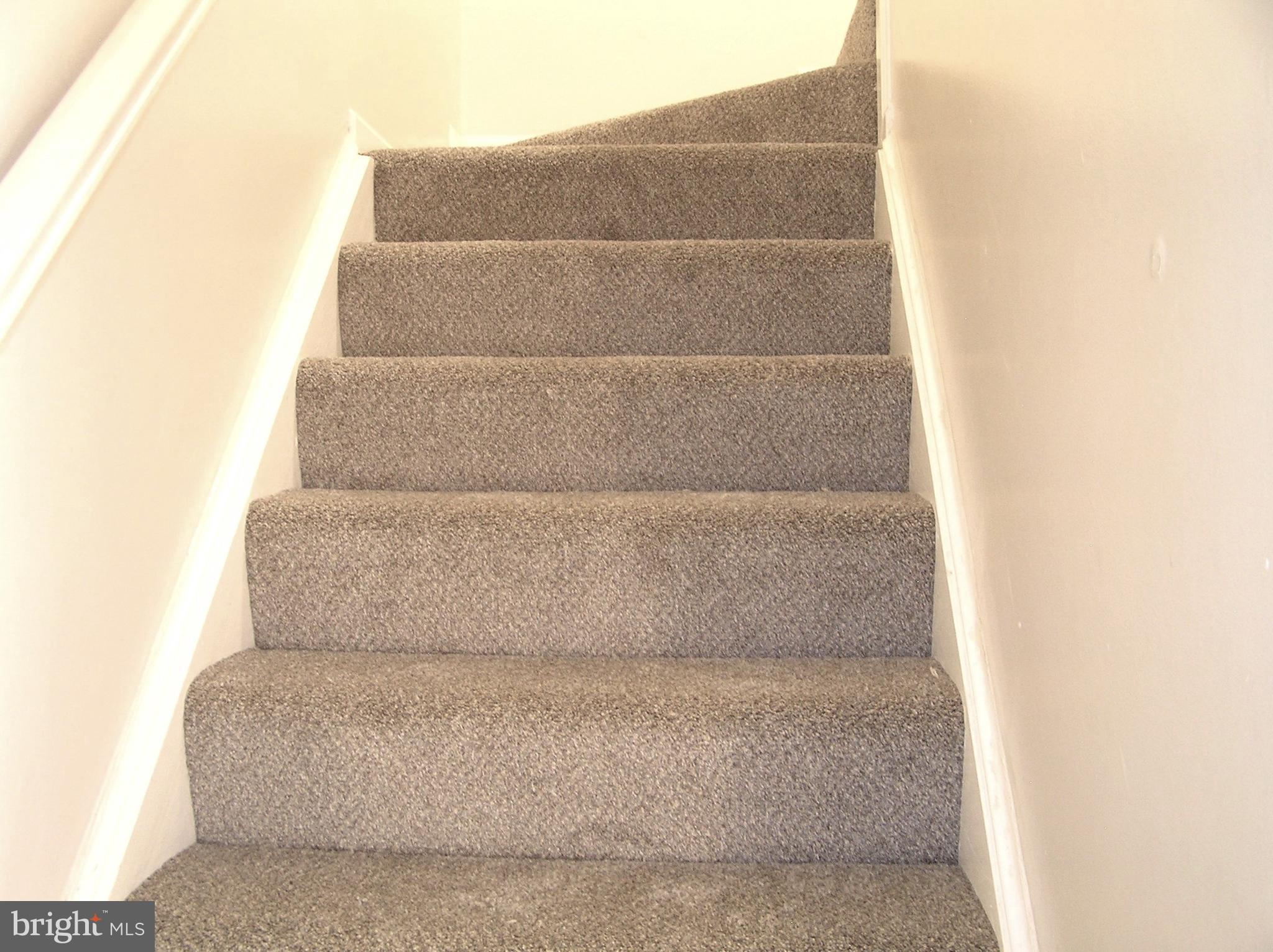 10053 Chestnut Wood Lane Burke, VA 22015 - Photo 10 of 28 a living room with a couch and a walk in closet