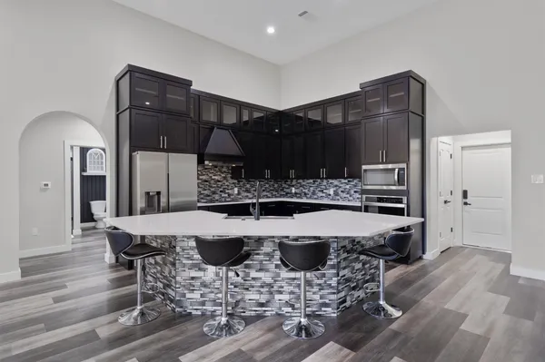 a kitchen with a table and chairs