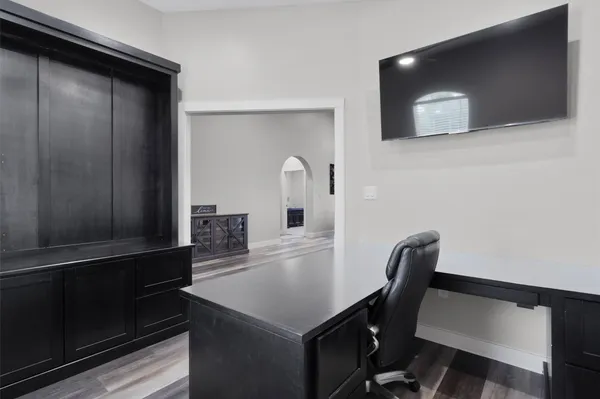 a view of a workspace with furniture