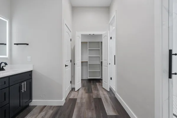 a view of a bathroom with a sink and a mirror