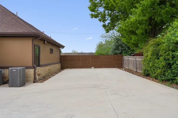 a street view with wooden fence