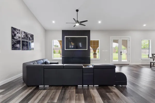 a living room with furniture window and wooden floor