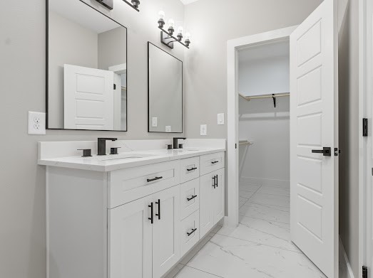 8216 Locksley Road, Unit B Houston, TX 77078 - Photo 15 of 15 a bathroom with double sink and a mirror