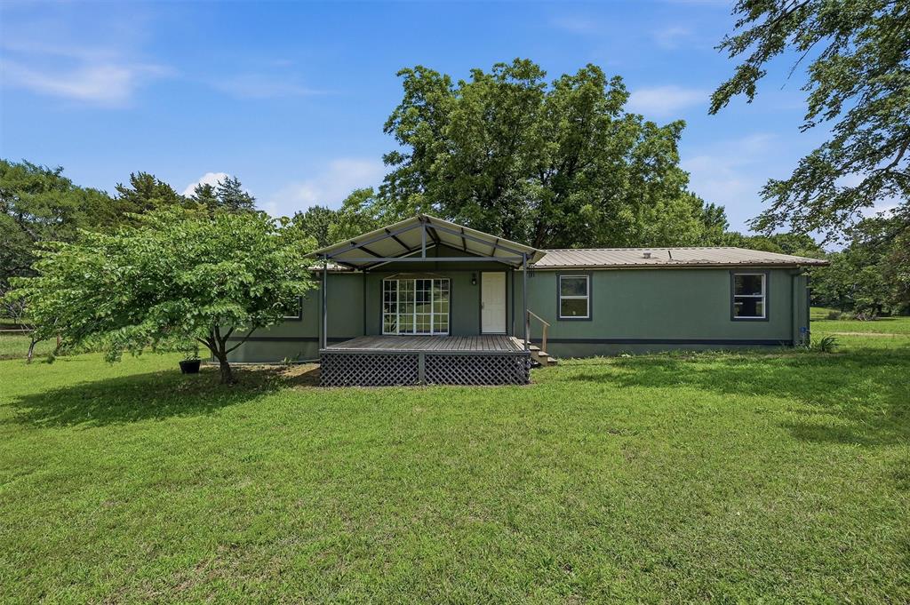 150 Gilbreath Road Sadler, TX 76264 - Photo 2 of 34 a front view of a house with a garden