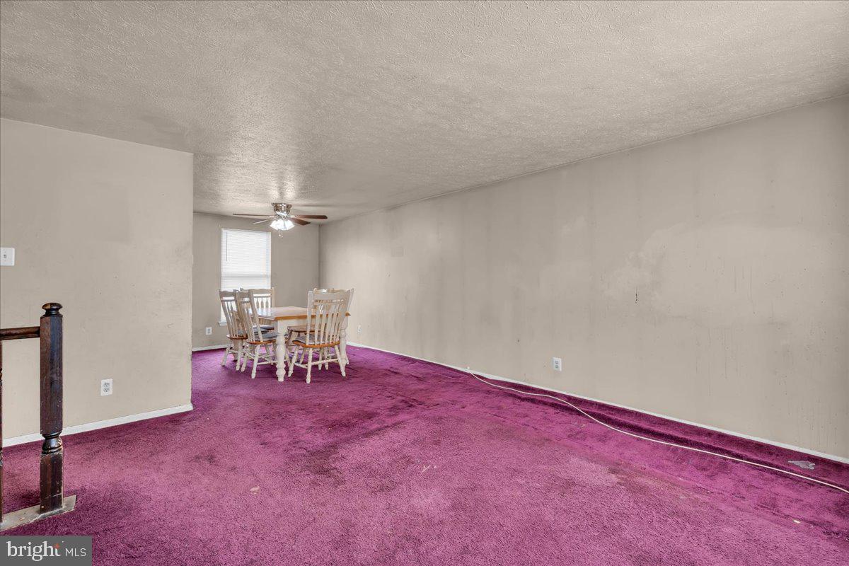 11 Decatur Lane Sicklerville, NJ 08081 - Photo 5 of 24 an empty room with chandelier fan and windows