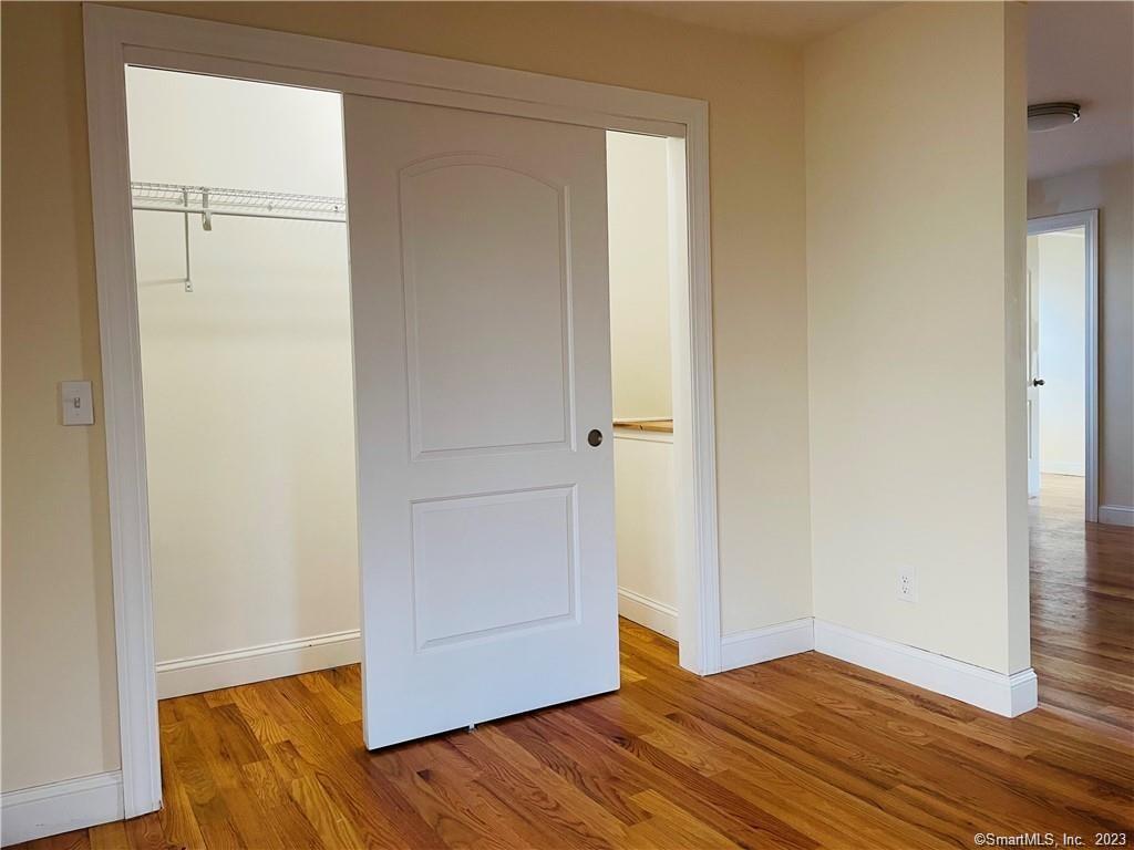 31 Brainerd Road, Unit 1 Branford, CT 06405 - Photo 15 of 17 a view of empty room with wooden floor