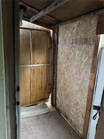 a view of a room that has a large window and closet