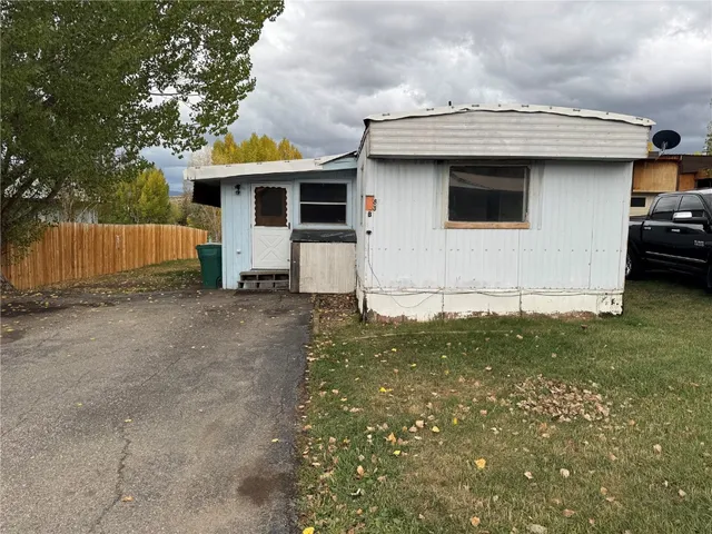 a view of a car park in front of house