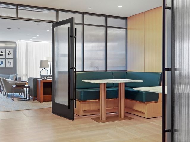 a kitchen with stainless steel appliances granite countertop a refrigerator and a stove