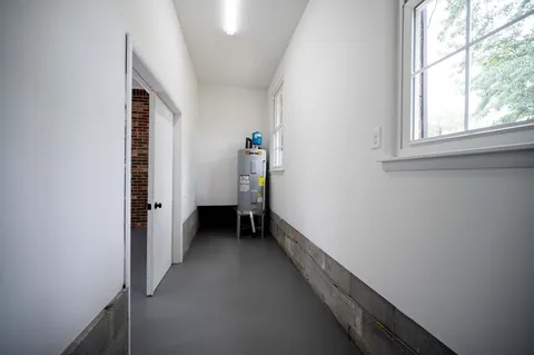 an entryway of a house and an empty room