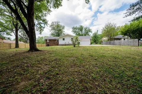 a house view with garden space