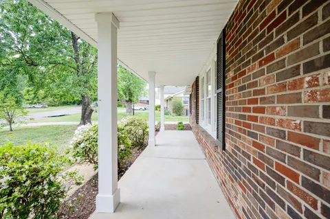 a view of a pathway both side of house