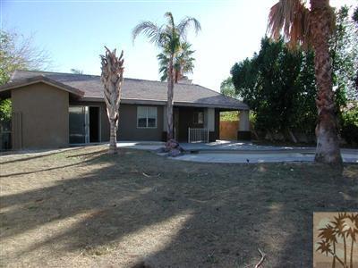 68180 Hermosillo Road Cathedral City, CA 92234 - Photo 15 of 18 a front view of a house with garden