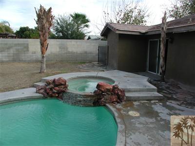 68180 Hermosillo Road Cathedral City, CA 92234 - Photo 17 of 18 a backyard of a house with lots of green space